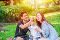 Asian teen family one kid happy holiday picnic moment in the park Royalty Free Stock Photo