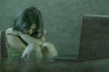 Asian teen girl bullied online . depressed and scared young woman with computer laptop suffering cyber bullying abused online by