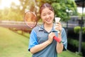 Asian Teen girl sport player with Badminton equipment for healthy outdoor portrait happy smile Royalty Free Stock Photo
