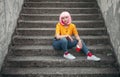 Trendy Asian teenager sitting on steps Royalty Free Stock Photo