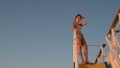 Asian teen standing on top of blue stair with yellow stripe Royalty Free Stock Photo