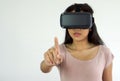 Asian teen using virtual reality glasses selecting menu on interactive game. Future Technology Concept