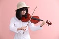 Asian teen with violin glasses hat smile Royalty Free Stock Photo