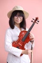 Asian teen with violin glasses hat smile Royalty Free Stock Photo