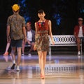 Asian teenage model wearing batik at fashion show runway