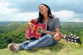 Asian teenager with guitar