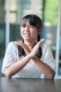 Asian teenager hand sign wronk symbol