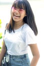 Asian teenager laughing with happiness emotion