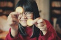 Asian teenager show cream cracker at home dinning room Royalty Free Stock Photo