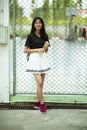 Asian  teenager smiling face holding pastic bottle in hand Royalty Free Stock Photo