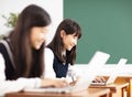 Teenager student learning online with laptop in classroom Royalty Free Stock Photo