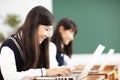 Teenager student learning online with laptop in classroom Royalty Free Stock Photo