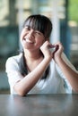 Asian teenager toothy smiling face and hand sign heart shape