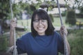 asian teenager toothy smiling with happiness face in kid park Royalty Free Stock Photo