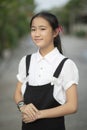 Asian teenager wearing black and white shirt toothy smiling face Royalty Free Stock Photo