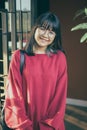 Asian teenager wearing red casual with smiling face Royalty Free Stock Photo