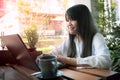 Asian teenager working on laptop at home living terrace Royalty Free Stock Photo
