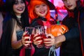 Asian Teenagers Drinking and Cheers in Halloween Costumes, Celebrate The Enchanting Halloween Season. Celebrating Halloween Haunt