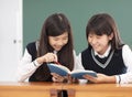 Teenagers girl student studying in classroom