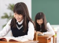 Teenagers girl student studying in classroom Royalty Free Stock Photo