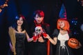 Asian Teenagers in Halloween Costumes Looking Camera, Invite For Enchanting Halloween Season Celebrations. Halloween Haunt Party