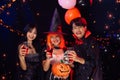 Asian Teenagers in Halloween Costumes Looking Camera, Invite For Enchanting Halloween Season Celebrations. Halloween Haunt Party