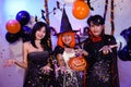 Asian Teenagers in Halloween Costumes Looking Camera, Invite For Enchanting Halloween Season Celebrations. Halloween Haunt Party