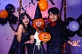 Asian Teenagers in Halloween Costumes Looking Camera, Invite For Enchanting Halloween Season Celebrations. Halloween Haunt Party