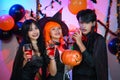 Asian Teenagers in Halloween Costumes Looking Camera, Invite For Enchanting Halloween Season Celebrations. Halloween Haunt Party