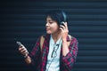 Asian. Teens are listening to music at close range with vintage tone