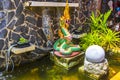 Asian thai artistic water fountain with dragons and snakes Thailand