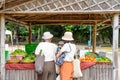 Asian Thai buyer choose Organic vegetable with Seller before buy it. This is creative fresh market in Chiang Mai Province,