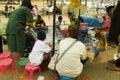 Asian thai children playing goldfish scooping game or paper scoop fish catch in tank Royalty Free Stock Photo