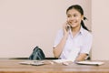 Asian Thai cute girl teen student school uniform using phone calling happy smile