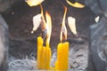 Asian Thai people and foreigner burning candle for respect and pray god at temple