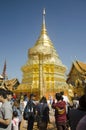 Asian thai people and foreigner respect pray and posing take photo with gold chedi at Wat Phra That Doi Suthep