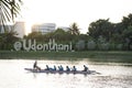 Asian thai people playing and practice sports paddle boat canoe in pond in dusk time of Nong Prajak Recreation Centre Public Park Royalty Free Stock Photo