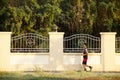 Asian thai people running jogging and exercise in dusk time at public garden park in Nonthaburi, Thailand.