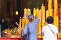 Asian Thai people worship the Buddha in Guan Yin Thien Fah Shrine with flowers, incense and large candles. Chinese temples is a