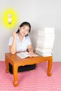 Asian Thai Student getting some idea Royalty Free Stock Photo