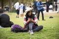 Asian thai woman sit and posing on grass garden for take photo