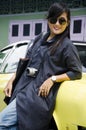 Asian thai woman travel and posing with retro yellow classic car Royalty Free Stock Photo