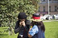 Asian thai women eating apples fruit from apple tree in public garden Royalty Free Stock Photo