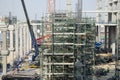 Asian thai workers and heavy machinery working builder new building at construction site high-rise building in Bangkok, Thailand. Royalty Free Stock Photo