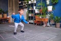 Asian toddler boy having fun jumping, playing hopscotch at home Royalty Free Stock Photo