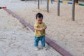 asian toddler boy playing in outdoor playground Royalty Free Stock Photo