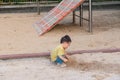 asian toddler boy playing in outdoor playground Royalty Free Stock Photo