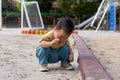 asian toddler boy playing in outdoor playground Royalty Free Stock Photo