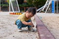 asian toddler boy playing in outdoor playground Royalty Free Stock Photo