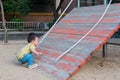 asian toddler boy playing in outdoor playground Royalty Free Stock Photo